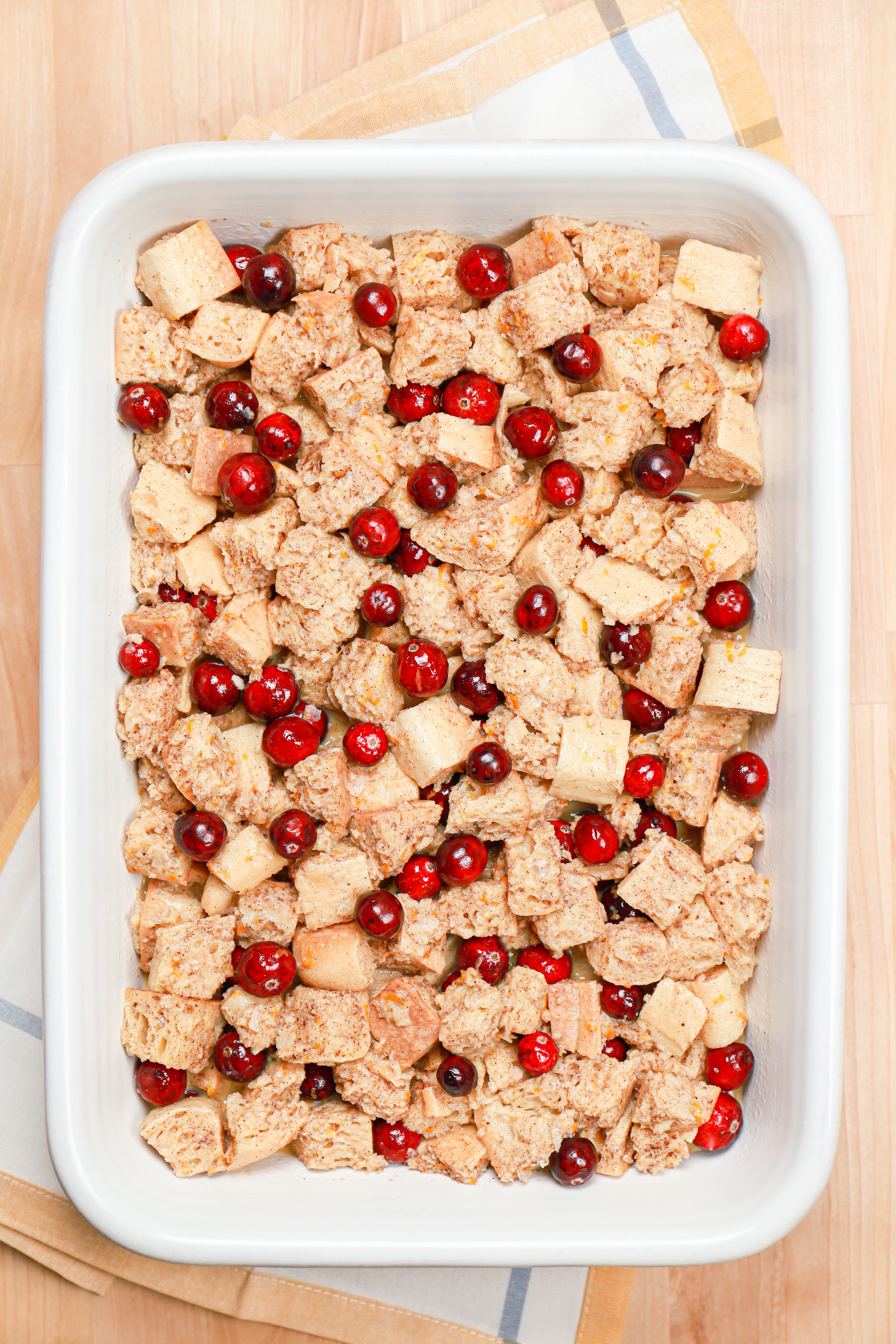 Overhead view of the cranberry orange french toast bake before the streusel and baking.